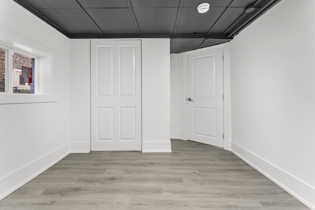 7732 W Sunset Dr, Elmwood Park, IL 60707 - basement featuring baseboards and light wood-type flooring