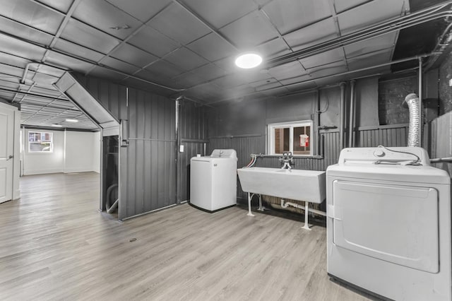 7732 W Sunset Dr, Elmwood Park, IL 60707 - washroom with a sink, laundry area, washer and dryer, and wood finished floors