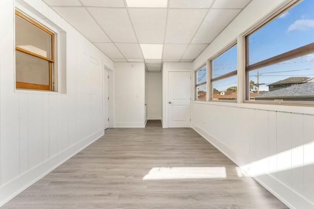 7732 W Sunset Dr, Elmwood Park, IL 60707 - empty room with light wood-type flooring, baseboards, and a paneled ceiling