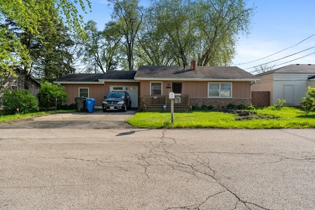 165 Ross Ave, South Elgin, IL 60177 - ranch-style home with asphalt driveway, brick siding, an attached garage, and a chimney