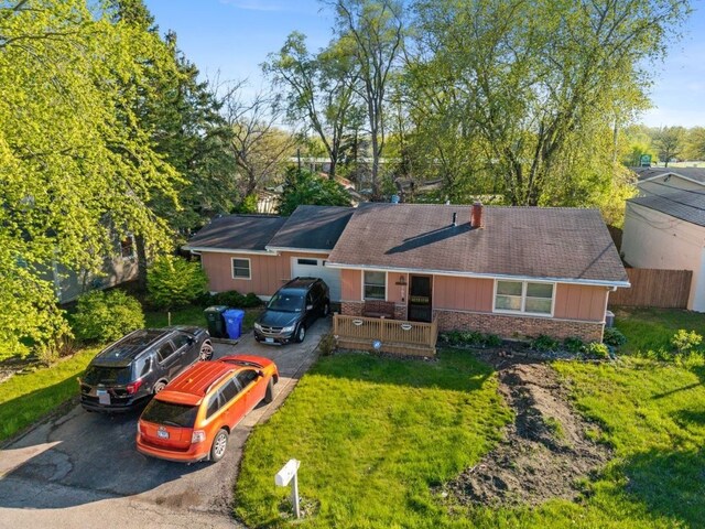 165 Ross Ave, South Elgin, IL 60177 - view of front of home with asphalt driveway, a front yard, and brick siding