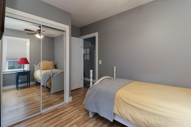 704 S Cottage Ave, Normal, IL 61761 - bedroom with light wood finished floors, baseboards, a ceiling fan, and a closet