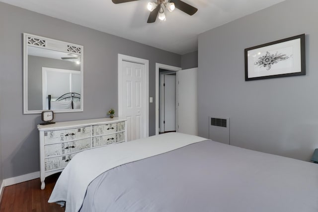 704 S Cottage Ave, Normal, IL 61761 - bedroom featuring dark wood-type flooring, baseboards, ceiling fan, and a closet