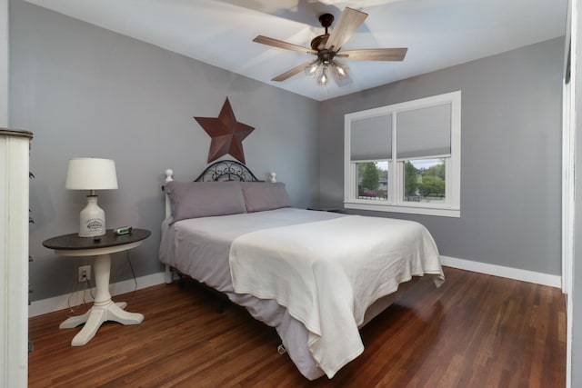 704 S Cottage Ave, Normal, IL 61761 - bedroom with baseboards, dark wood-style flooring, and a ceiling fan
