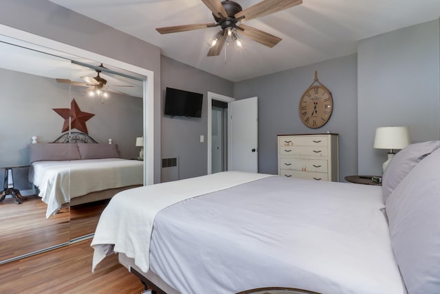 704 S Cottage Ave, Normal, IL 61761 - bedroom featuring wood finished floors, a closet, and a ceiling fan
