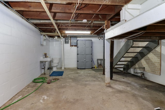 704 S Cottage Ave, Normal, IL 61761 - unfinished below grade area featuring stairs, electric panel, and concrete block wall
