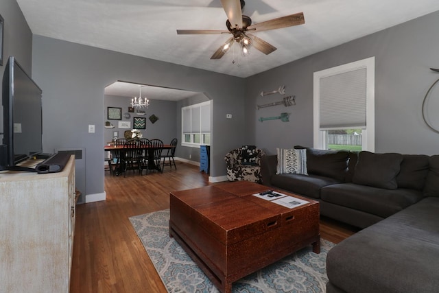704 S Cottage Ave, Normal, IL 61761 - living area with arched walkways, a chandelier, dark wood-type flooring, and plenty of natural light