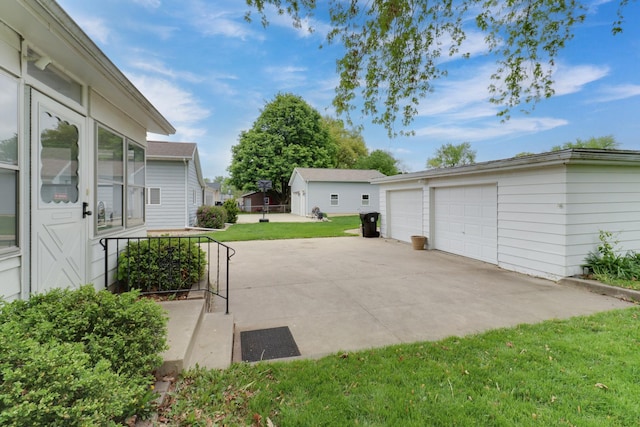 704 S Cottage Ave, Normal, IL 61761 - view of green lawn featuring an outbuilding and a detached garage