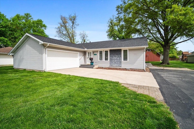 ranch-style house featuring driveway, an attached garage, and a front lawn