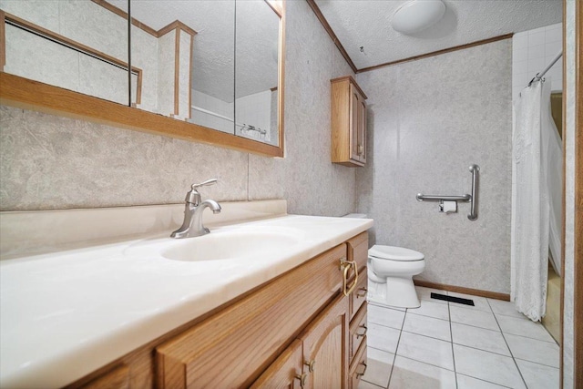 bathroom with toilet, vanity, tile patterned floors, a textured ceiling, and curtained shower