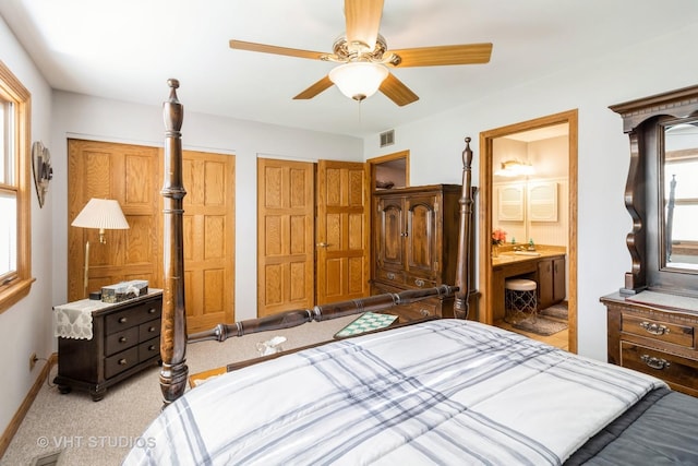 6 Sandalwood Ct, Streamwood, IL 60107 - bedroom with multiple closets, light carpet, ensuite bath, a ceiling fan, and baseboards