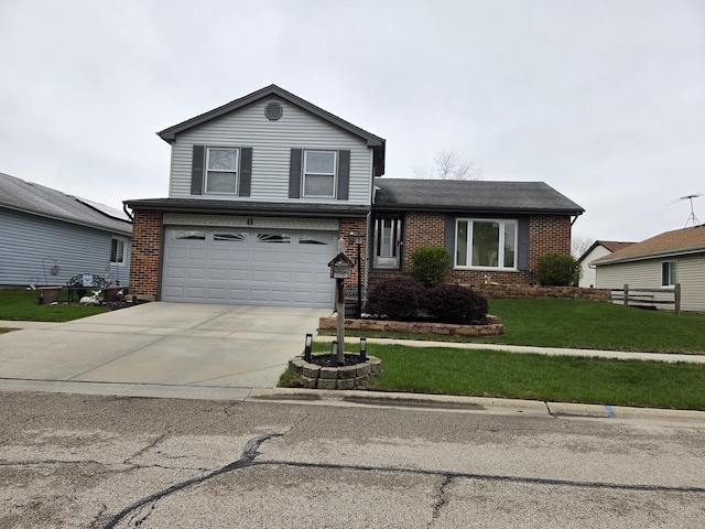 6 Sandalwood Ct, Streamwood, IL 60107 - split level home featuring a garage, concrete driveway, a front yard, brick siding, and roof with shingles