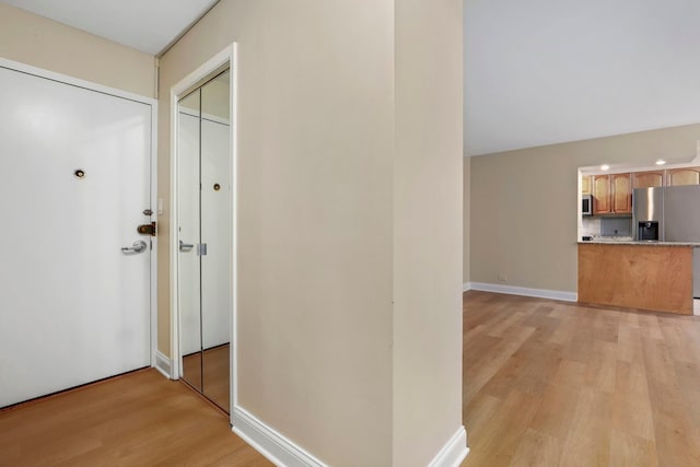 3950 N Lake Shore Dr Unit 720D, Chicago, IL 60613 - hall featuring baseboards and light wood-style floors