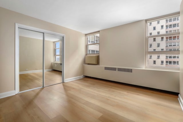 3950 N Lake Shore Dr Unit 720D, Chicago, IL 60613 - unfurnished bedroom with a closet, visible vents, wood finished floors, and baseboards