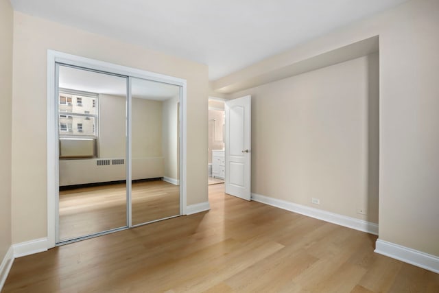 3950 N Lake Shore Dr Unit 720D, Chicago, IL 60613 - unfurnished bedroom with baseboards, light wood finished floors, and a closet