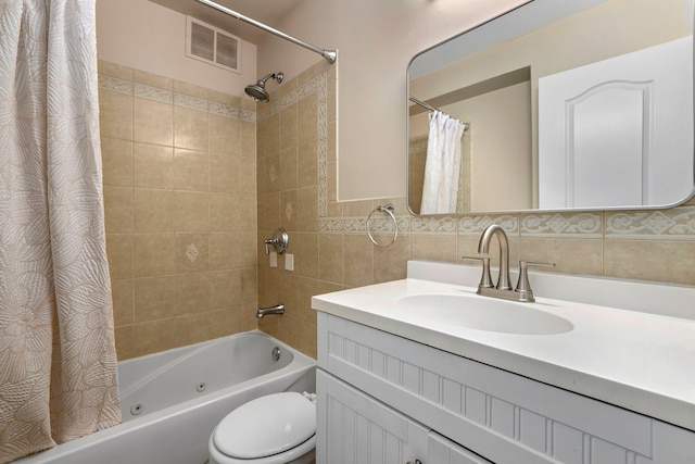 3950 N Lake Shore Dr Unit 720D, Chicago, IL 60613 - bathroom featuring tile walls, toilet, visible vents, shower / bath combination with curtain, and vanity