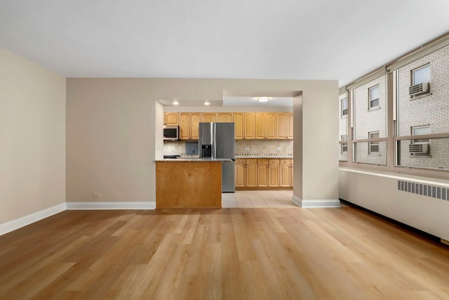 3950 N Lake Shore Dr Unit 720D, Chicago, IL 60613 - kitchen featuring stainless steel appliances, light wood-type flooring, baseboards, light countertops, and tasteful backsplash