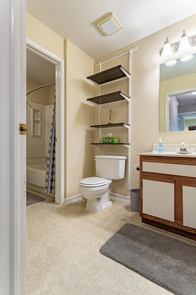 full bath with toilet, tile patterned flooring, vanity, and baseboards
