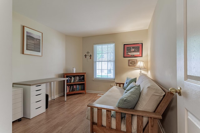 sitting room with light wood-style floors and baseboards