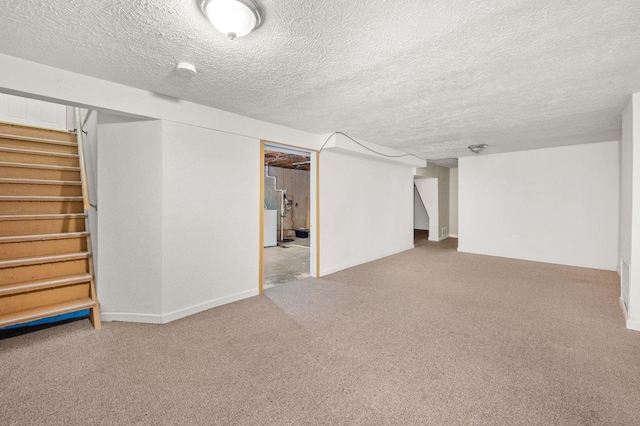927 Lakeview Dr, Rochelle, IL 61068 - finished basement with stairs, carpet floors, a textured ceiling, and baseboards