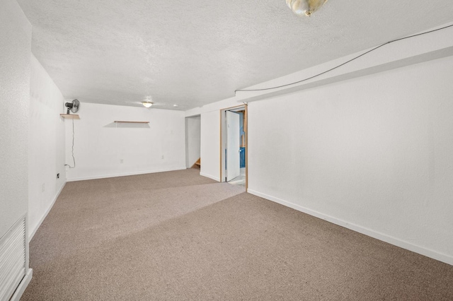 927 Lakeview Dr, Rochelle, IL 61068 - finished below grade area with carpet floors, a textured ceiling, and baseboards