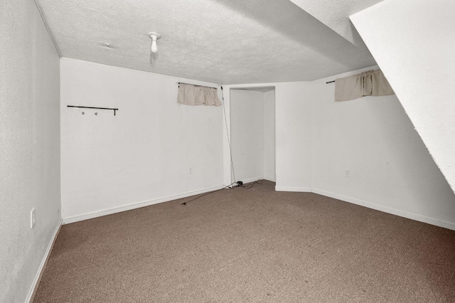 927 Lakeview Dr, Rochelle, IL 61068 - finished below grade area featuring carpet, a textured ceiling, and baseboards