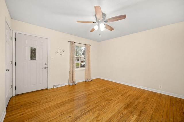 927 Lakeview Dr, Rochelle, IL 61068 - spare room with light wood-type flooring, a ceiling fan, and baseboards