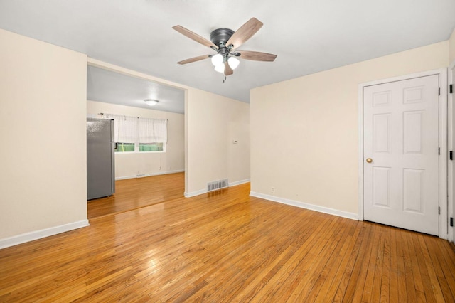 927 Lakeview Dr, Rochelle, IL 61068 - spare room with ceiling fan, light wood-style flooring, and baseboards