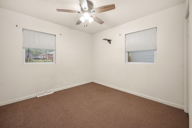 927 Lakeview Dr, Rochelle, IL 61068 - unfurnished room featuring carpet floors, a ceiling fan, and baseboards