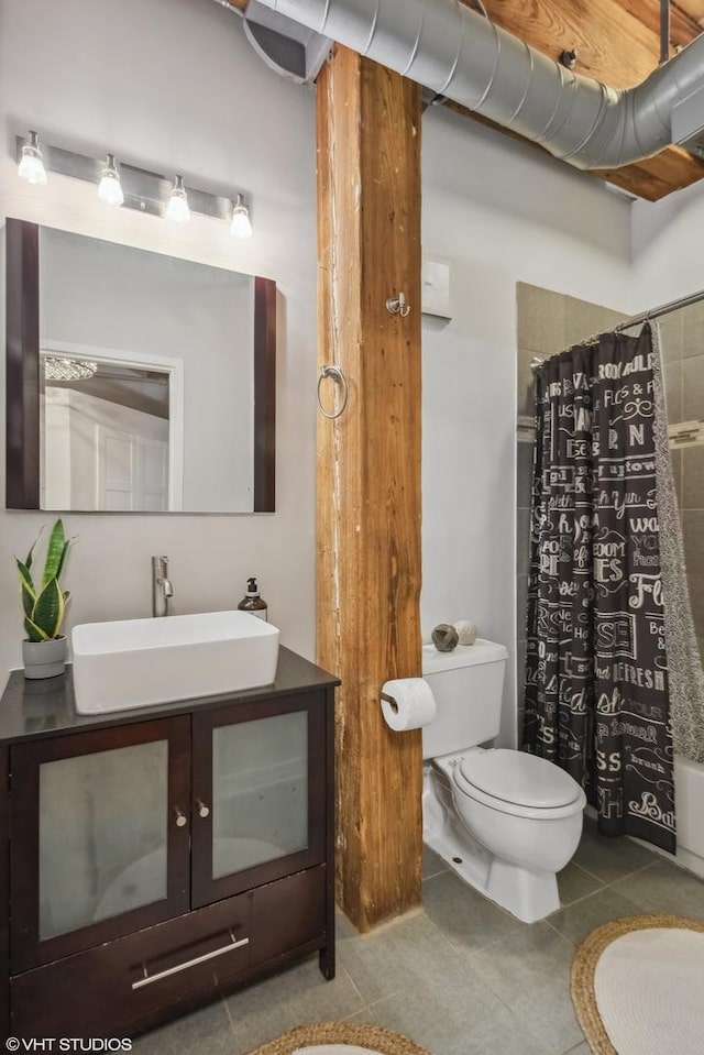 225 W Huron St Unit 507, Chicago, IL 60654 - full bathroom with curtained shower, toilet, tile patterned floors, and vanity