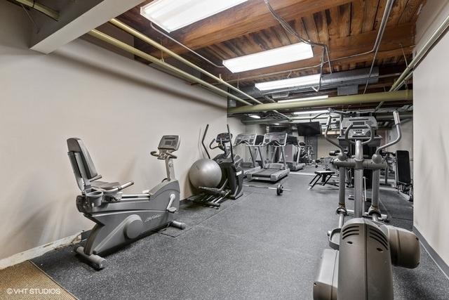 225 W Huron St Unit 507, Chicago, IL 60654 - workout area featuring baseboards