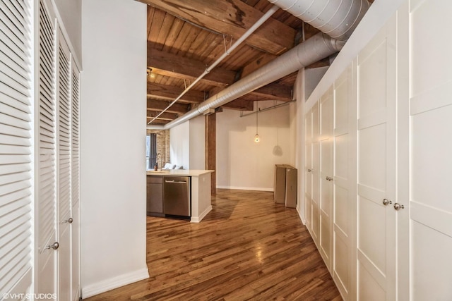 225 W Huron St Unit 507, Chicago, IL 60654 - below grade area featuring fridge, wood ceiling, baseboards, and wood finished floors