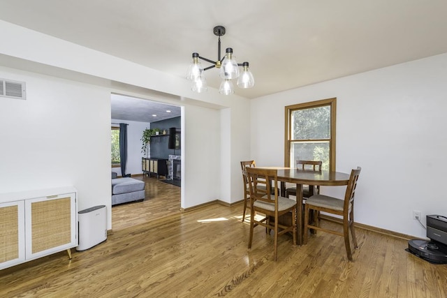 3128 Frans Ct, Winthrop Harbor, IL 60096 - dining area featuring wood finished floors, a chandelier, and baseboards