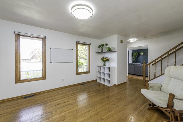3128 Frans Ct, Winthrop Harbor, IL 60096 - living area featuring wood finished floors, baseboards, and stairway