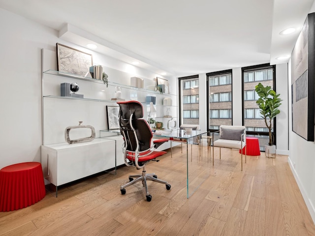 office space with wood finished floors and recessed lighting