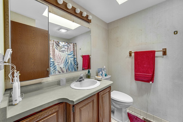23505 S 88th Ave, Green Garden, IL 60423 - full bath featuring a skylight, toilet, vanity, tile patterned floors, and a shower with curtain