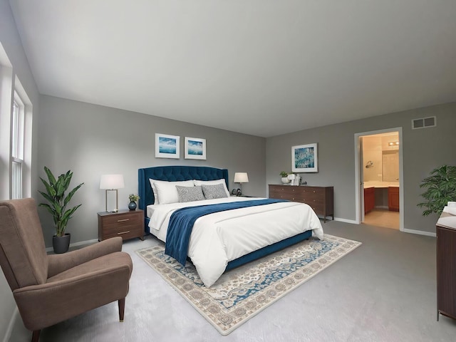 carpeted bedroom featuring baseboards, connected bathroom, and visible vents