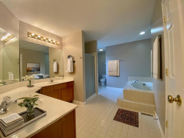 bathroom featuring visible vents, a bath, a shower stall, tile patterned flooring, and vanity