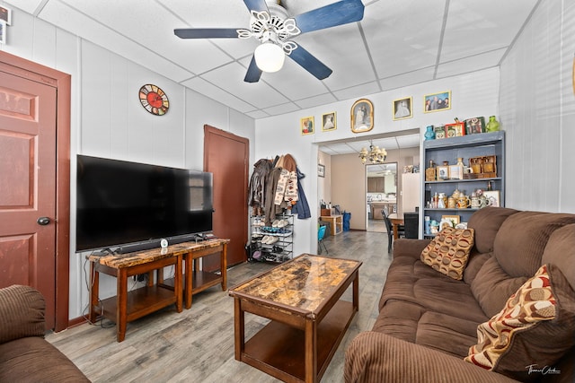 2862 S Keeley St, Chicago, IL 60608 - living room featuring light wood finished floors and ceiling fan with notable chandelier