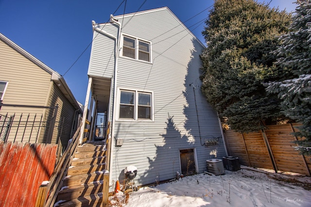 2862 S Keeley St, Chicago, IL 60608 - snow covered back of property with central AC unit and fence
