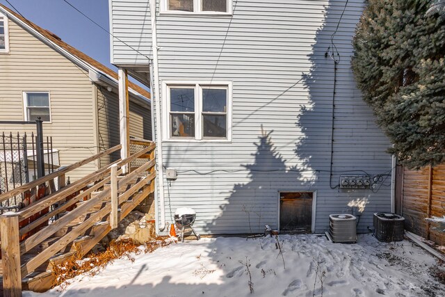 2862 S Keeley St, Chicago, IL 60608 - snow covered rear of property featuring stairway and fence
