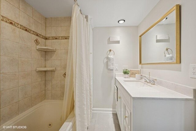 bathroom with vanity, shower / bath combination with curtain, baseboards, and tile patterned floors