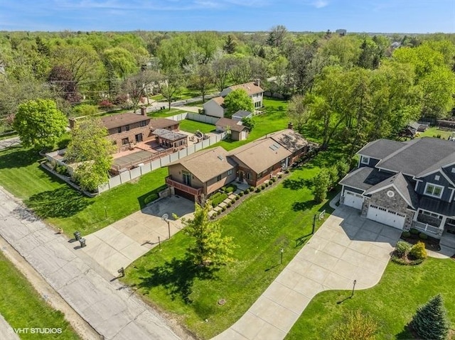 aerial perspective of suburban area with a heavily wooded area