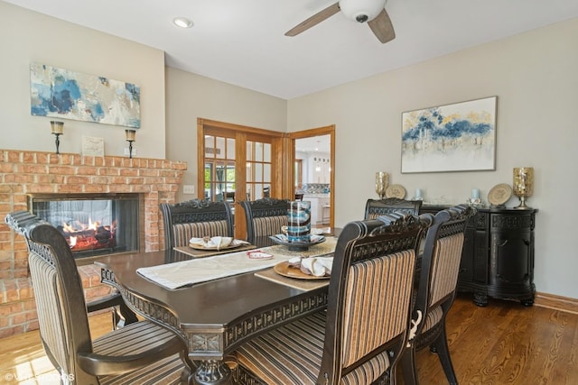 26464 N Bittersweet Trl, Mundelein, IL 60060 - dining space with ceiling fan, wood finished floors, a brick fireplace, and recessed lighting