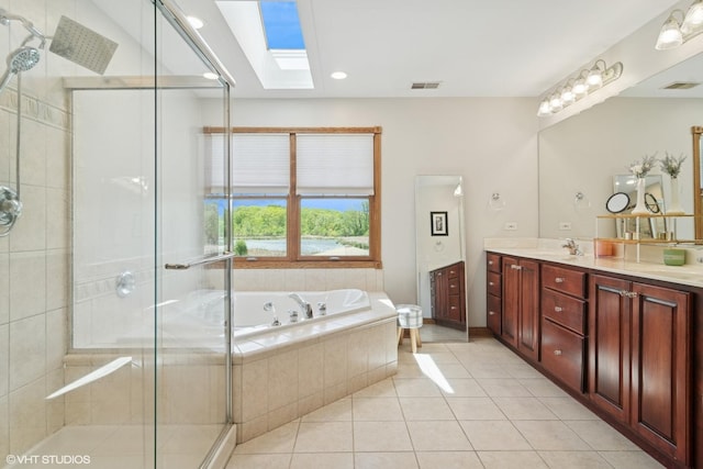 26464 N Bittersweet Trl, Mundelein, IL 60060 - full bath with a skylight, double vanity, a tub with jets, a shower stall, and tile patterned floors