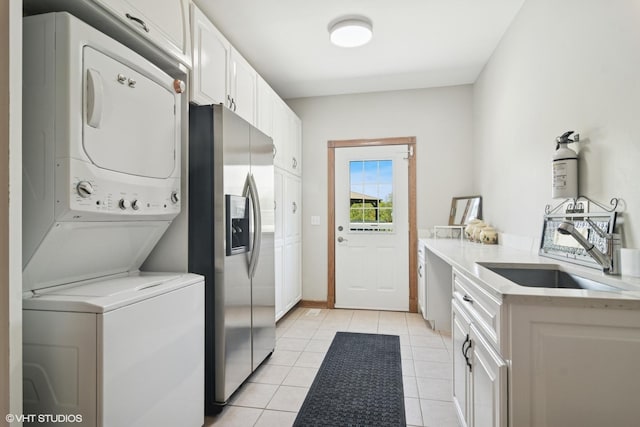 26464 N Bittersweet Trl, Mundelein, IL 60060 - laundry area featuring stacked washer / dryer and light tile patterned floors