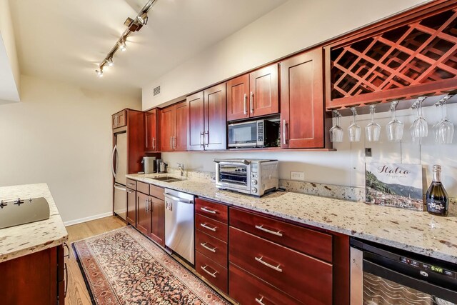3180 N Lake Shore Dr Unit 4F, Chicago, IL 60657 - kitchen featuring appliances with stainless steel finishes, wine cooler, light wood-type flooring, and reddish brown cabinets
