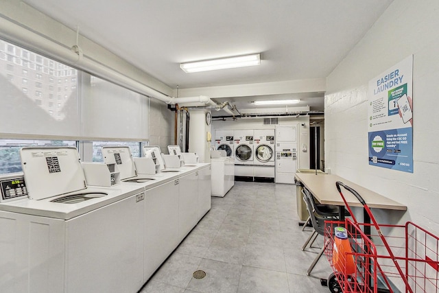 3180 N Lake Shore Dr Unit 4F, Chicago, IL 60657 - communal laundry room featuring independent washer and dryer, stacked washer / drying machine, and light tile patterned floors