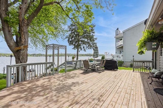 3714 W Lake Shore Dr, Wonder Lake, IL 60097 - deck featuring a water view and outdoor dining area