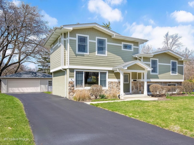 504 S Pierce Ave, Wheaton, IL 60187 - view of front of house featuring stone siding, a detached garage, and a front yard